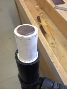 outside black pipe is 1 1/2 inch. inner color is a 1 inch coupling. with a 1 inch dowel insert.